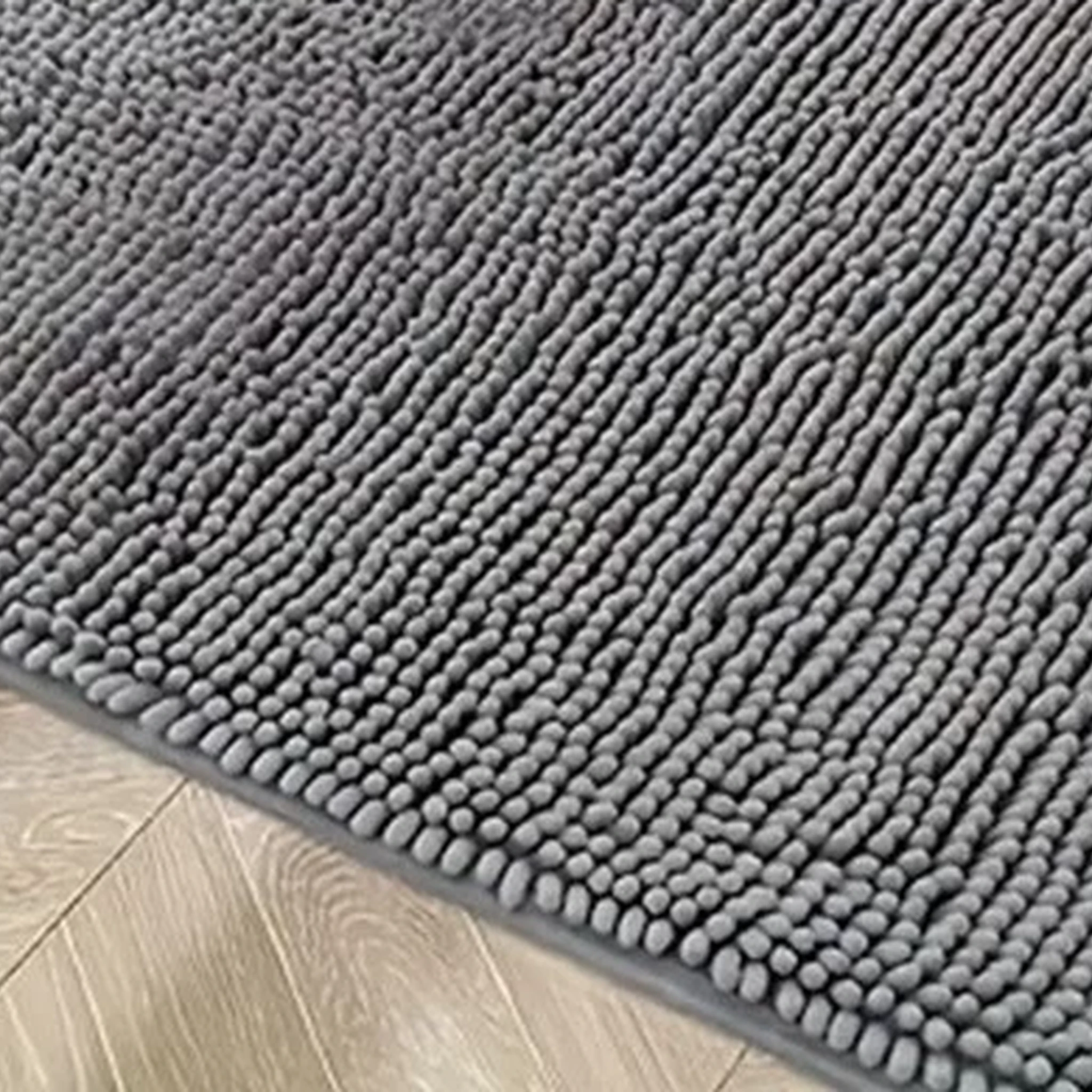 Close-up of the mat's narrow bound edge and Deep Grey top surface