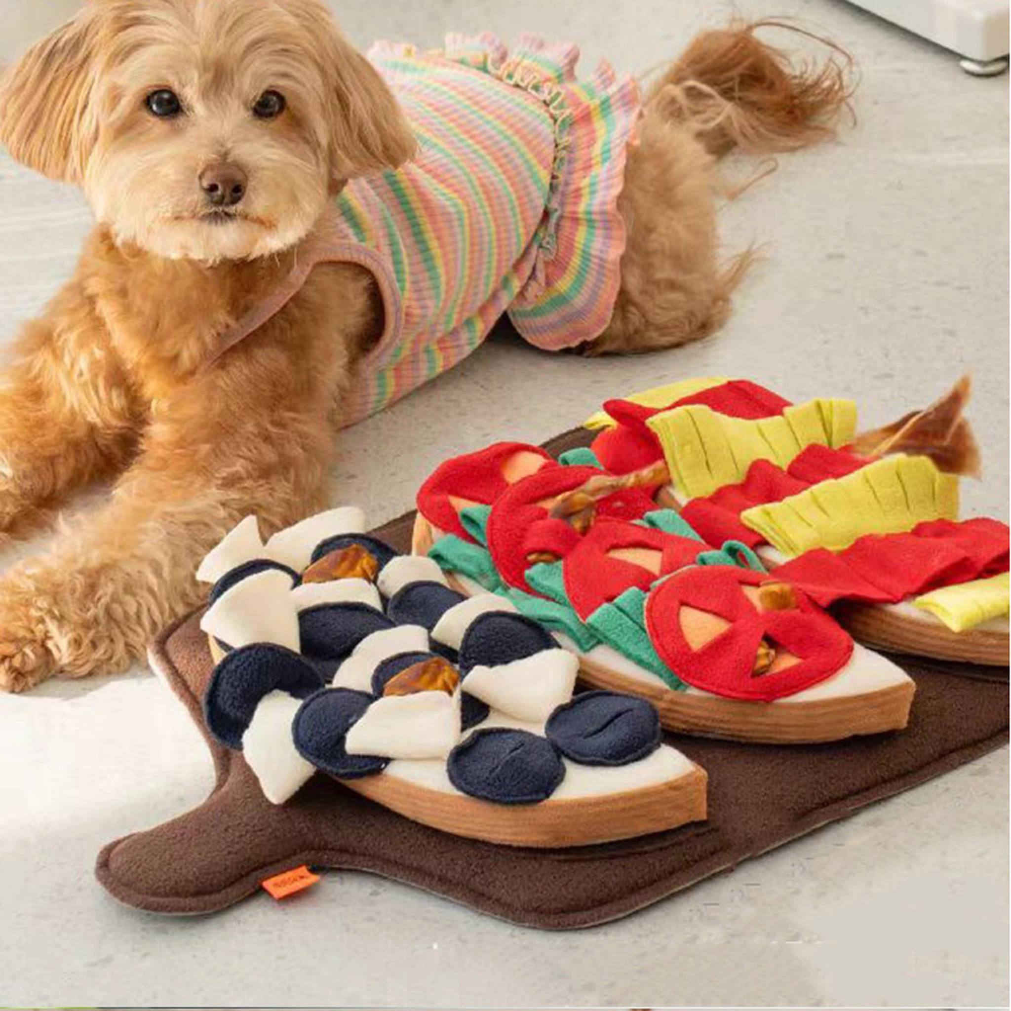 Dog using the food-platter snuffle mat during supervised sniffing play