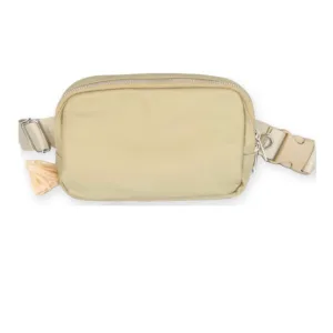 Beige dog walking crossbody bag shown from the front on a white background