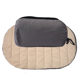 Beige dog travel mat with grey packed form