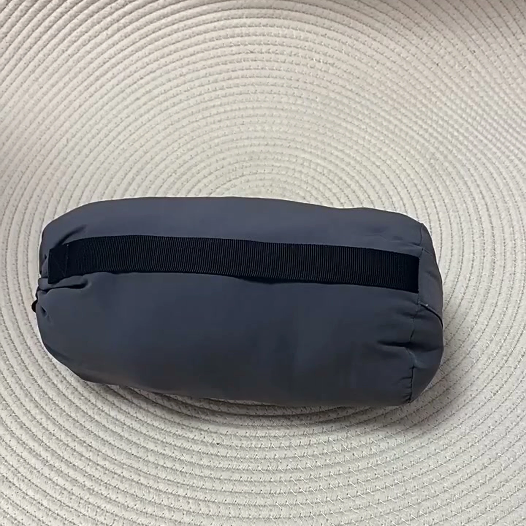 Grey packed dog mat with black carry handle